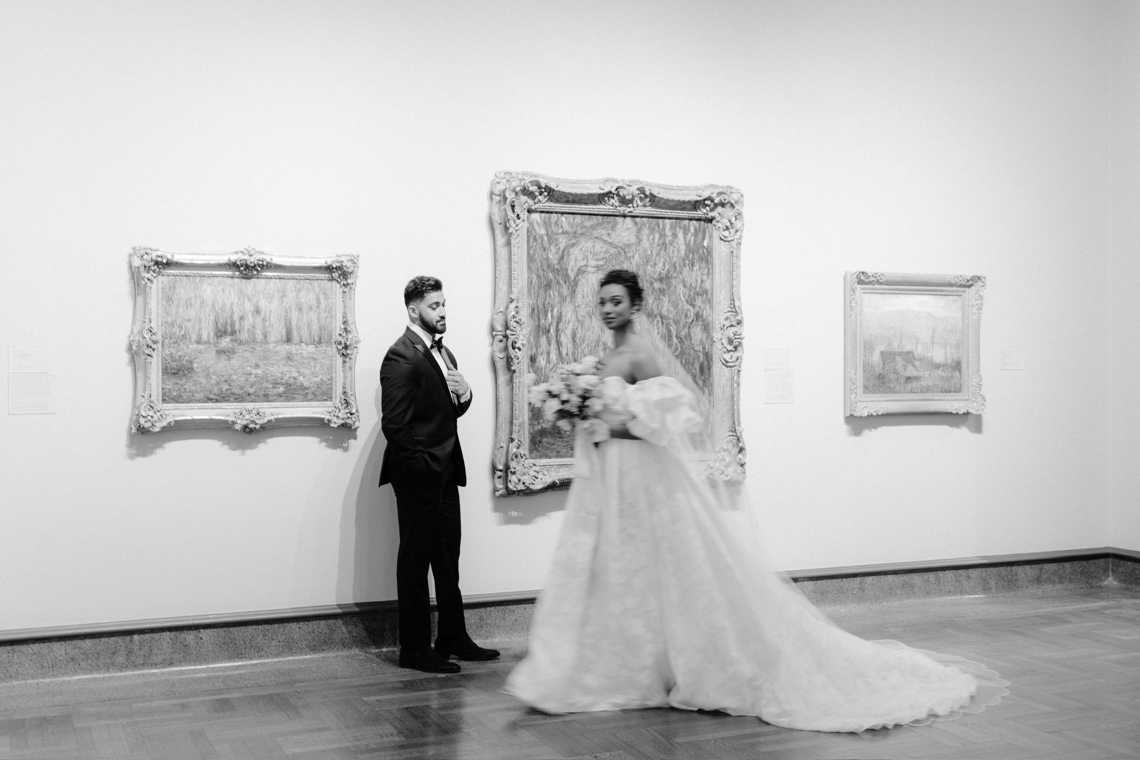 Bride and groom wedding portrait in art gallery